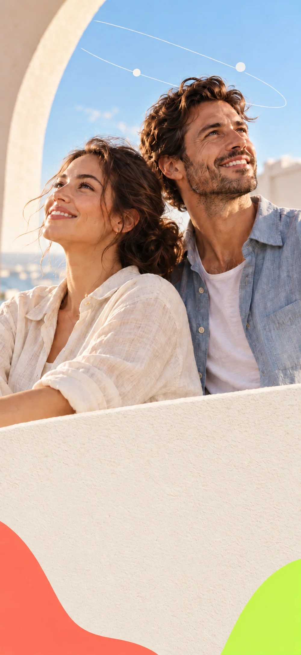 Two people looking up together in warm sunlight beneath a cream arch.